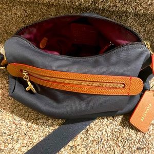 Crossbody Canvas Coach Bag. Navy, fawn brown, and purple.